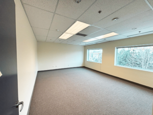 Photograph of a large meeting room with two large windows in the BAO office