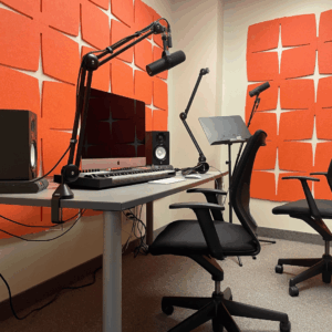 BAO Recording Studio with an iMac, midi keyboard, microphones and speakers at a desk