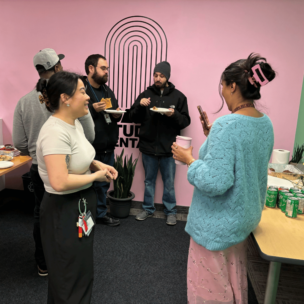 Photograph from the BAO Studio Rentals potluck of artists socializing together